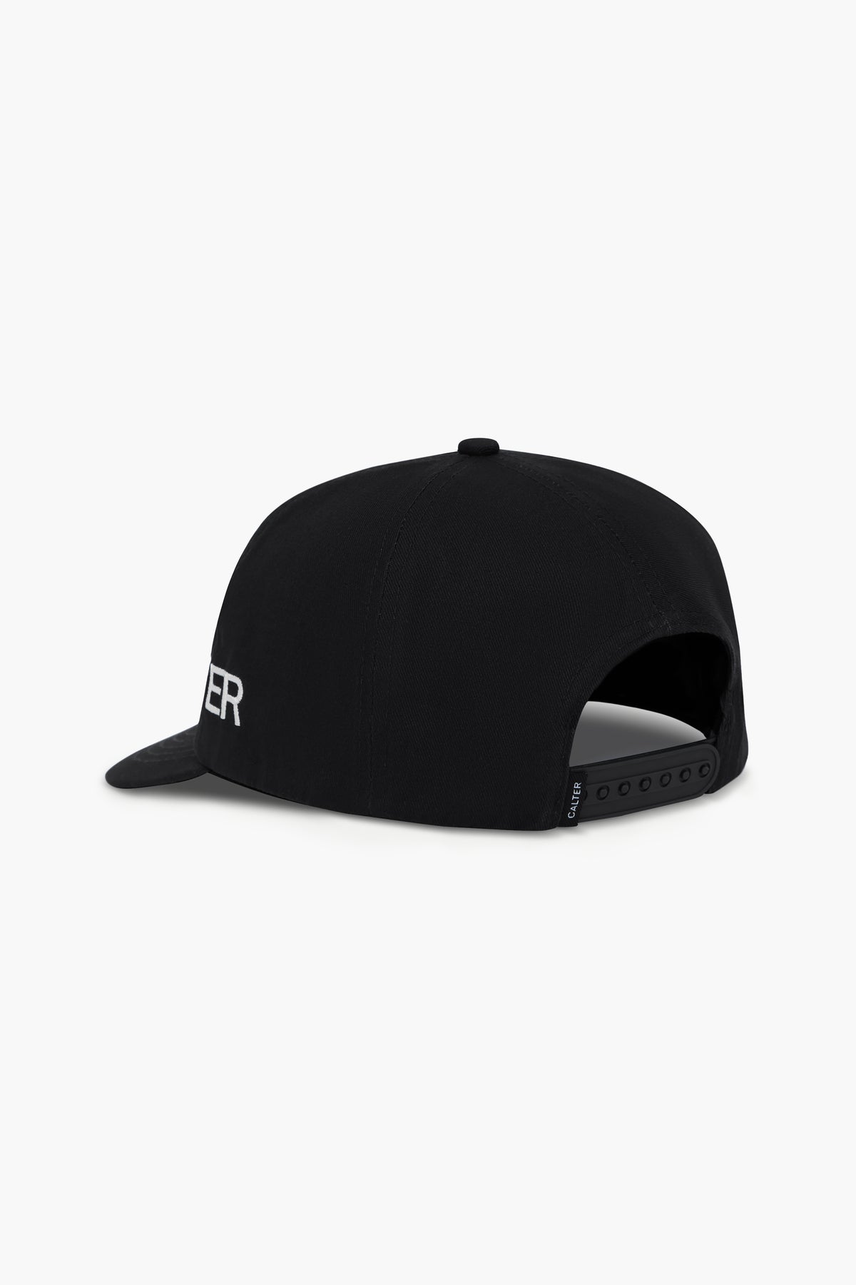 Black Studio Cap, rear three-quarter view, showing the snapback closure and woven CALTER label.