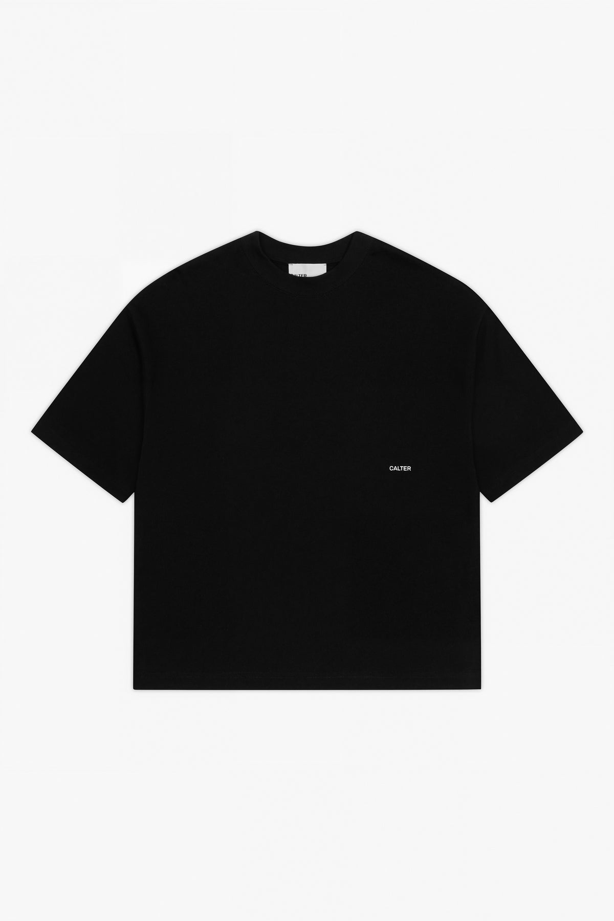 Black Stamp Tee, front view, with a white CALTER print at the left chest.