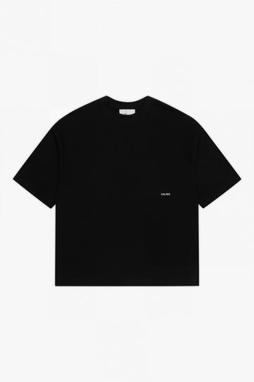Black Stamp Tee, front view, with a white CALTER print at the left chest.