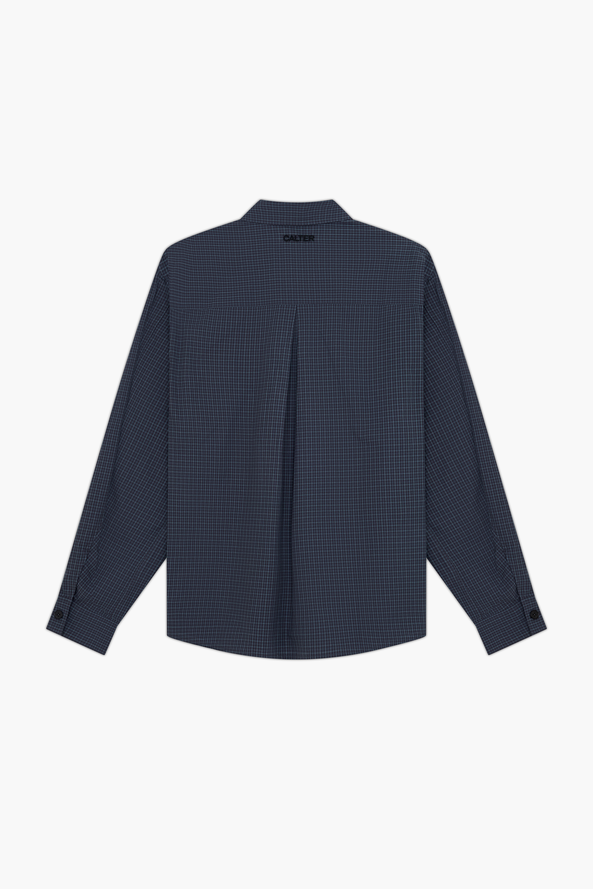 Slate Microcheck Studio Shirt, back view, showing the inverted box pleat and black CALTER embroidery below the collar.