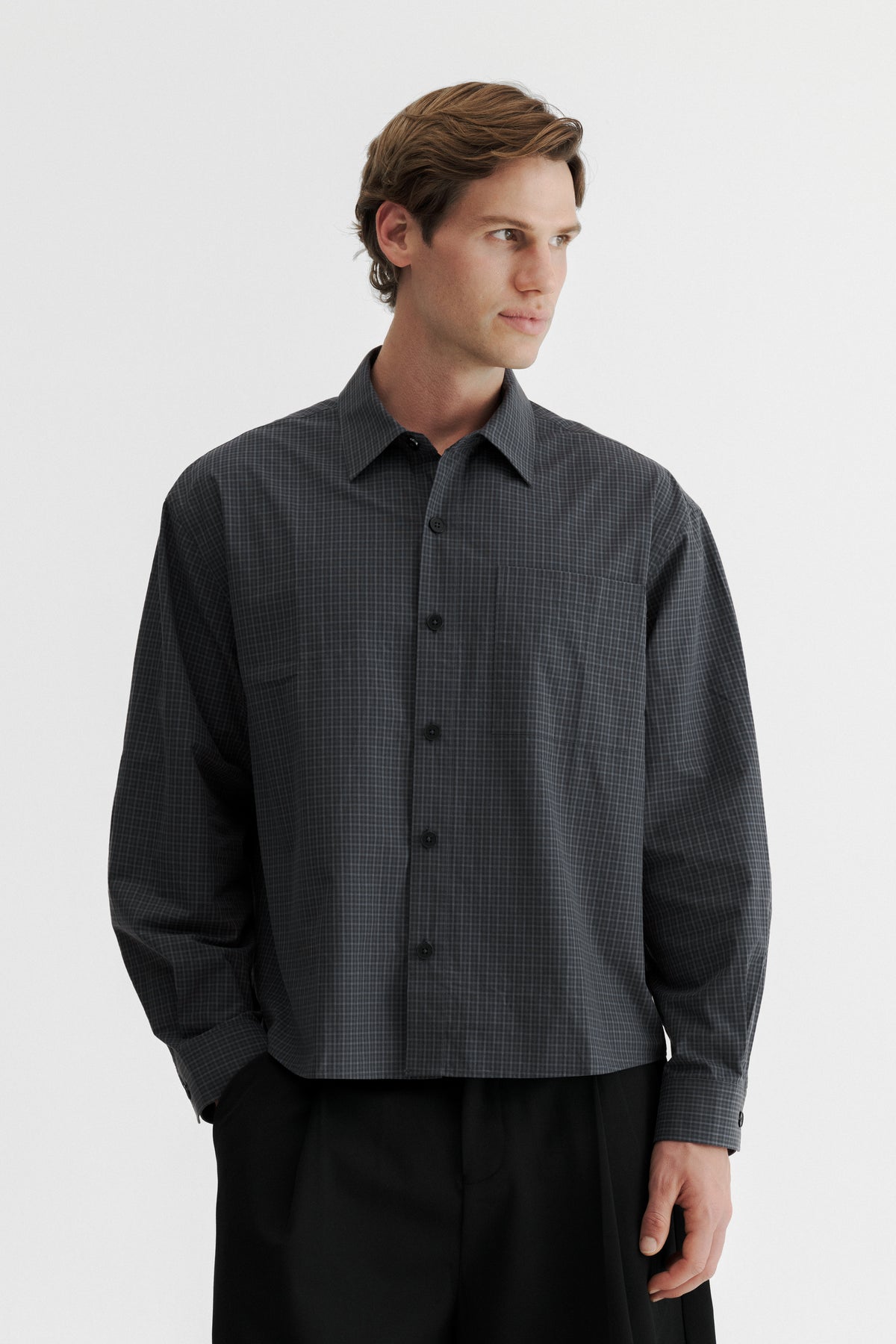 Model wearing the Slate Microcheck Studio Shirt, showing the wide proportions and shortened body length.